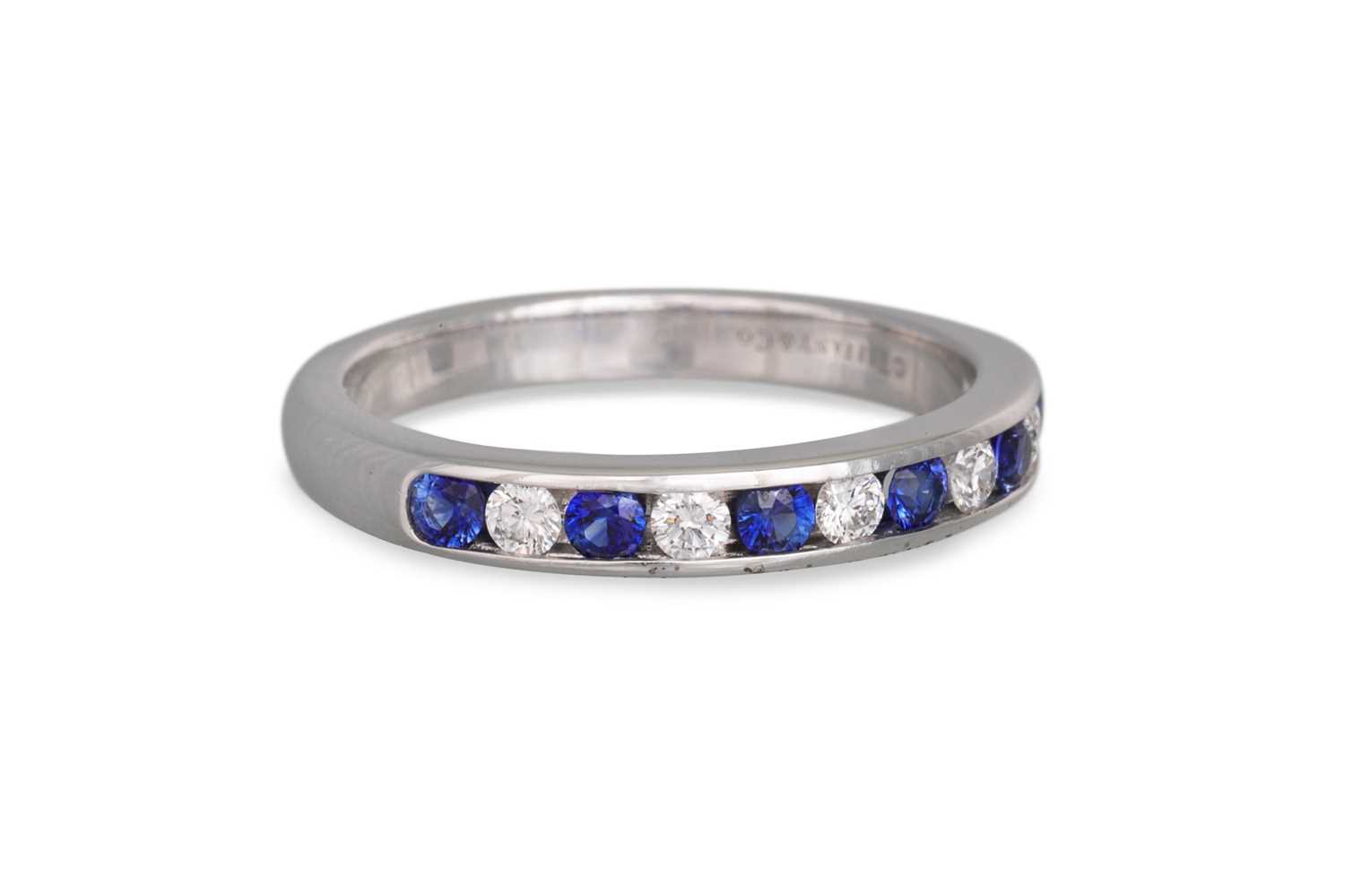 Lot 315 - A TIFFANY DIAMOND AND SAPPHIRE HALF ETERNITY...