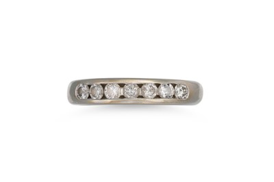 Lot 255 - A DIAMOND HALF ETERNITY RING, channel set with...