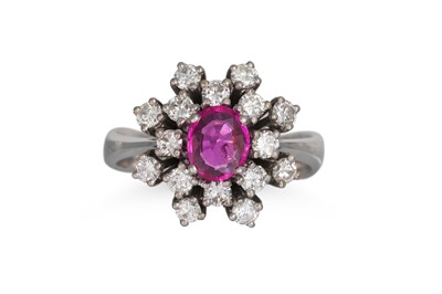 Lot 394 - A RUBY AND DIAMOND CLUSTER RING, the oval ruby...