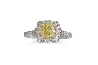 Lot 454 - A DIAMOND CLUSTER RING, the radiant fancy...