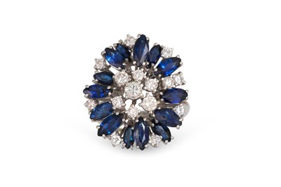 Lot 416 - A DIAMOND AND SAPPHIRE CLUSTER RING, set with...