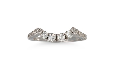 Lot 447 - A DIAMOND BAND RING, of shaped form set with...