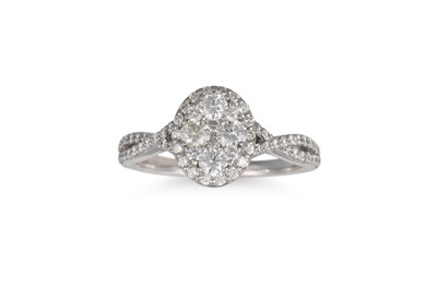 Lot 407 - A DIAMOND CLUSTER RING, of oval form, set with...