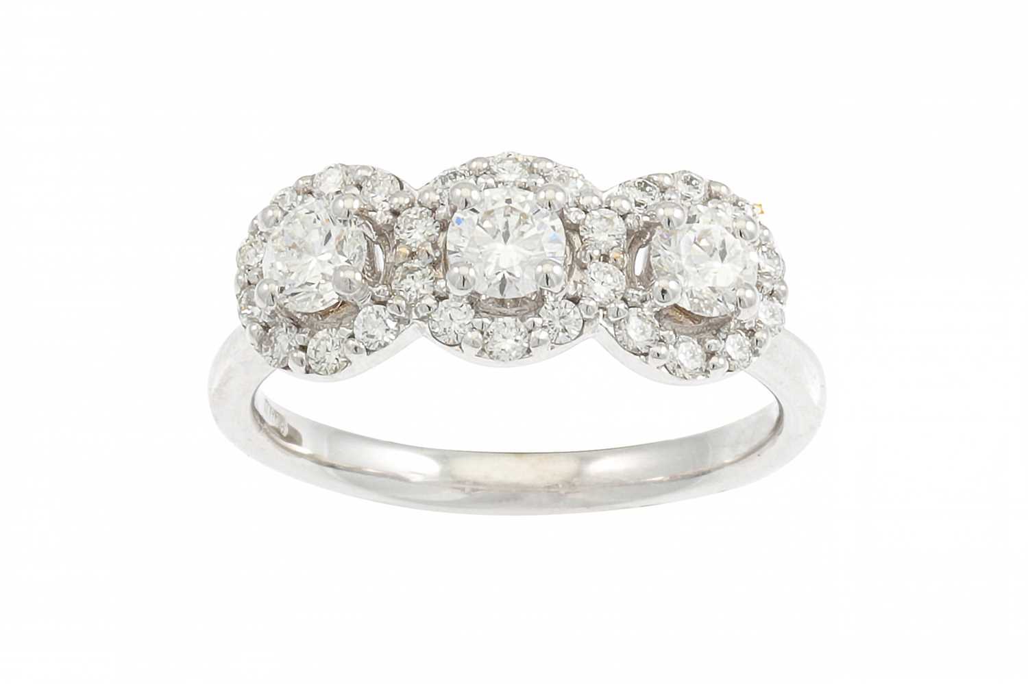 Lot 309 - A DIAMOND TRIPLE HALO CLUSTER RING, the...