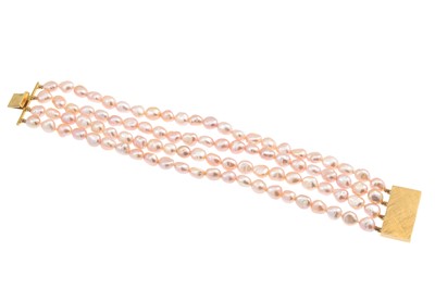 Lot 311 - A PEARL BRACELET, four rowed with pink tones,...