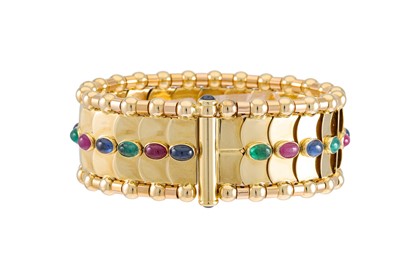 Lot 313 - AN 18CT GOLD BANGLE, set with Cabochon, Rubies,...