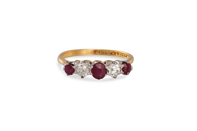 Lot 316 - A SEVEN STONE DIAMOND AND RUBY RING, mounted...