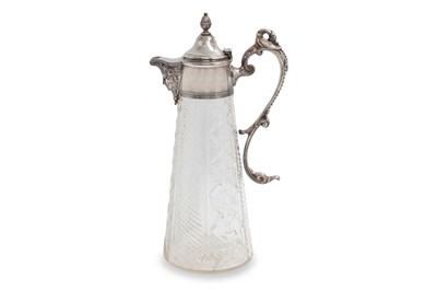 Lot 480 - A VINTAGE GLASS CLARET JUG, with silver plated...