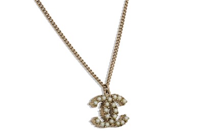 Lot 2 - A CHANEL 'DOUBLE C' PENDANT, on a chain, boxed,...