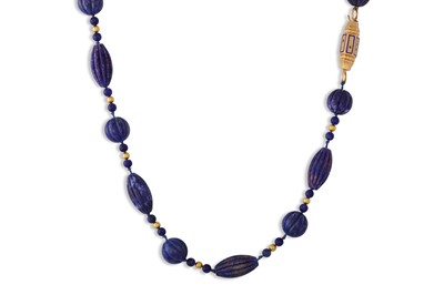 Lot 39 - A SODALITE NECKLACE, carved beads, enamelled...