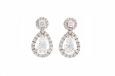 Lot 324 - A PAIR OF DIAMOND CLUSTER EARRINGS, the pear...