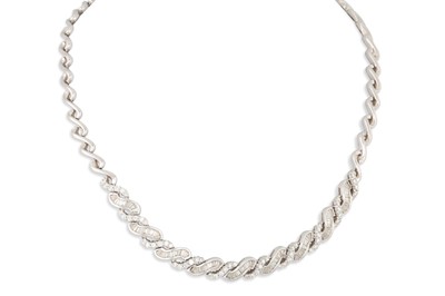 Lot 370 - A DIAMOND NECKLACE, set with baguette and...