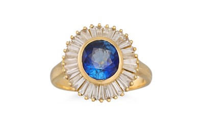 Lot 338 - A DIAMOND AND SAPPHIRE CLUSTER RING, the oval...