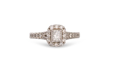 Lot 234 - A DIAMOND CLUSTER RING, the emerald cut...