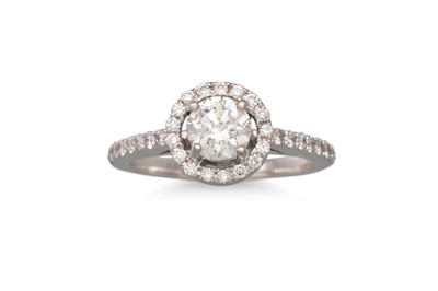 Lot 211 - A DIAMOND HALO CLUSTER RING, the diamond to...
