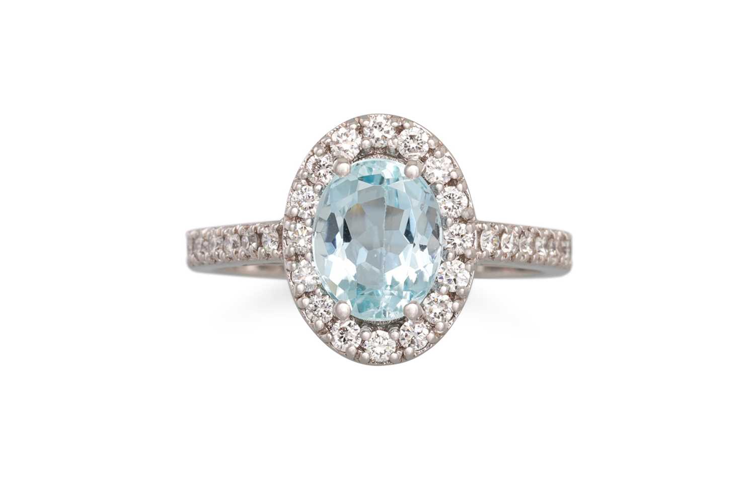 Lot 180 - AN AQUAMARINE AND DIAMOND CLUSTER RING, the...