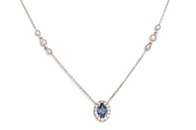 Lot 183 - A DIAMOND AND SAPPHIRE CLUSTER PENDANT, on a...