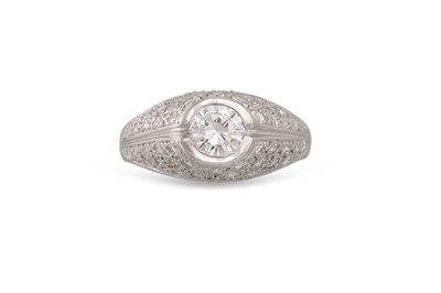 Lot 327 - A DIAMOND BOMBE STYLE RING, the round...