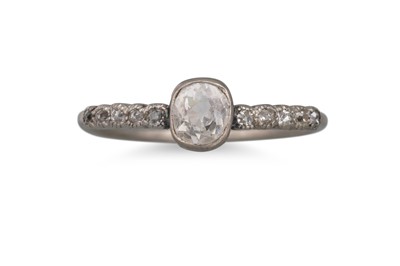 Lot 282 - A DIAMOND RING, set with an old cushion cut...