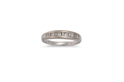 Lot 457 - A DIAMOND HALF ETERNITY RING, channel set with...