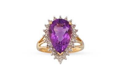 Lot 24 - A DIAMOND AND AMETHYST CLUSTER RING, the pear...