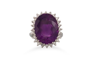 Lot 81 - A DIAMOND AND AMETHYST CLUSTER RING, the large...