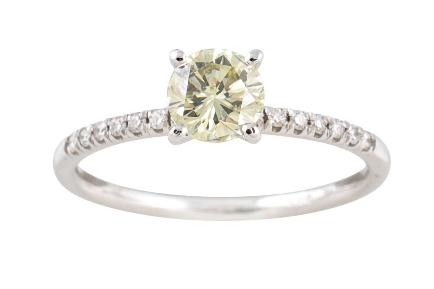 Lot 121 - A FANCY YELLOW DIAMOND SOLITAIRE RING, to...