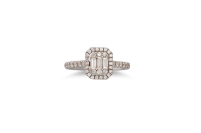 Lot 390 - A DIAMOND CLUSTER RING, set with baguette and...