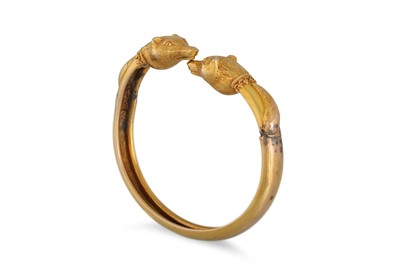 Lot 344 - A YELLOW GOLD FOX HEAD BANGLE, open-ended...
