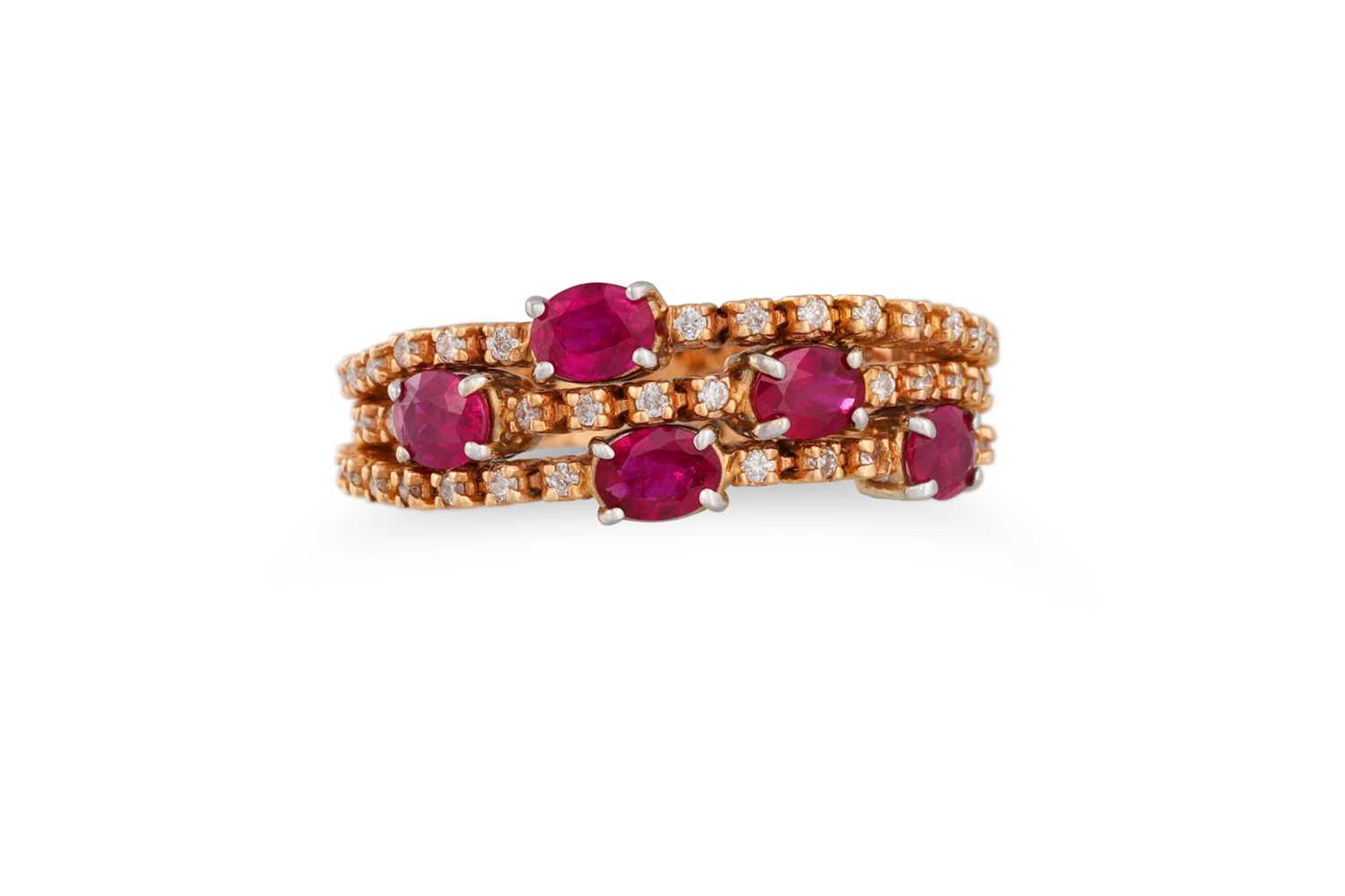 Lot 171 - A RUBY AND DIAMOND BAND TRIPLE ROW FLEXI RING,...