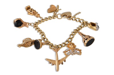 Lot 294 - A GOLD CHARM BRACELET, the curb link bracelet...