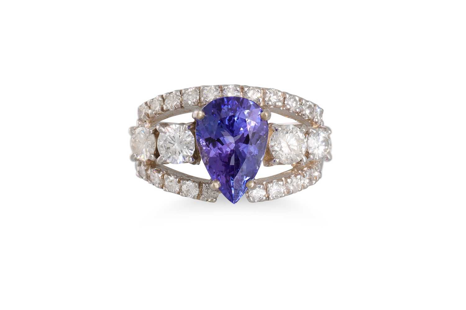Lot 244 - A TANZANITE AND DIAMOND RING, the pear shaped...
