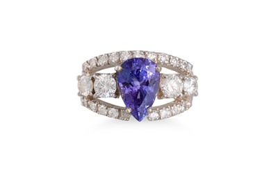 Lot 244 - A TANZANITE AND DIAMOND RING, the pear shaped...