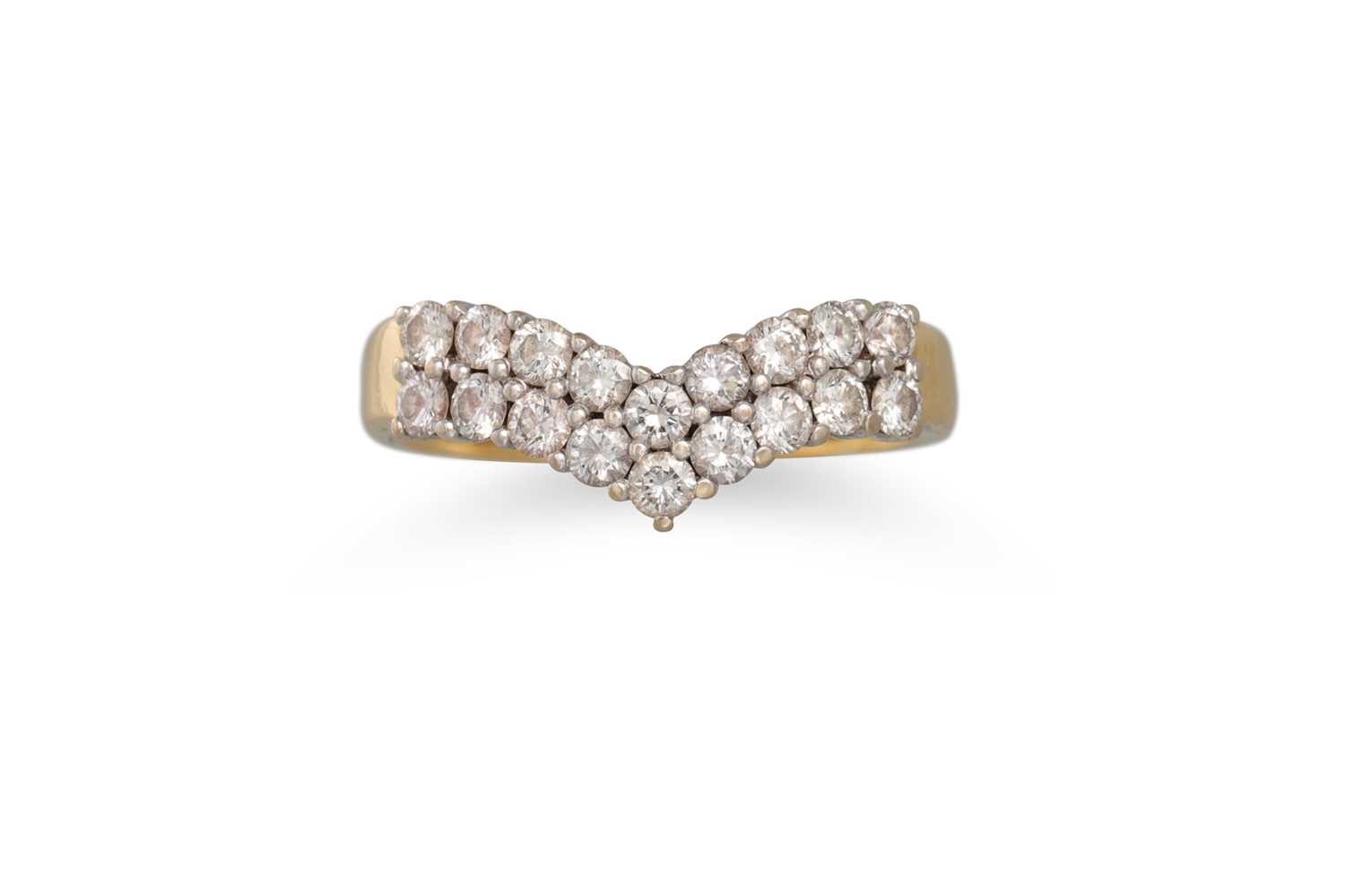 Lot 185 - A TWO ROWED DIAMOND RING, of shaped form, the...