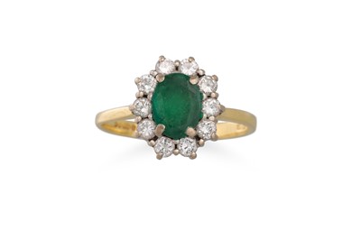 Lot 299 - A DIAMOND AND EMERALD CLUSTER RING, the oval...