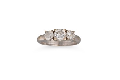 Lot 178 - A THREE STONE DIAMOND RING, the brilliant cut...