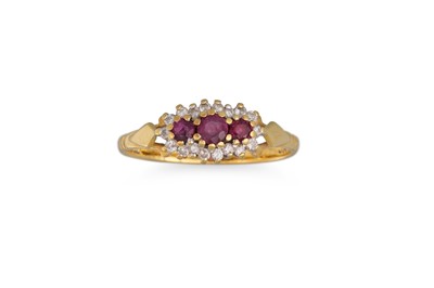 Lot 477 - A RUBY AND DIAMOND CLUSTER RING, mounted in...