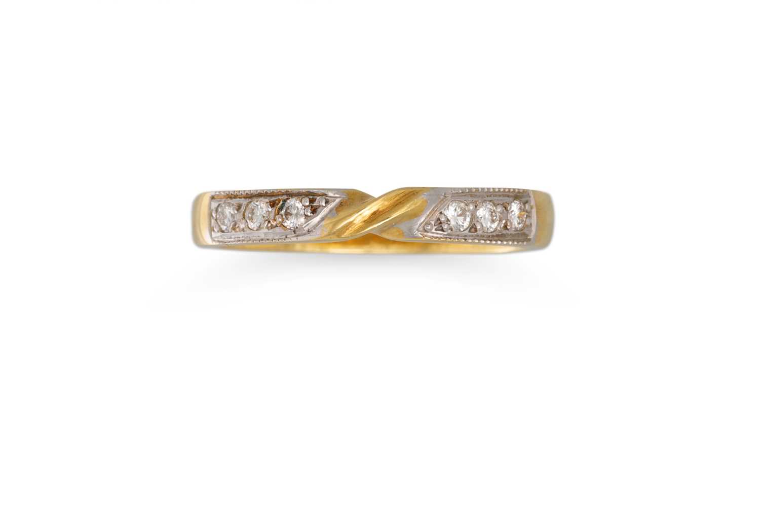 Lot 162 - A DIAMOND BAND RING, of twist form, mounted in...