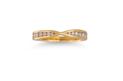 Lot 123 - A DIAMOND BAND RING, shaped form, channel set...