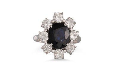 Lot 81 - A SAPPHIRE AND DIAMOND CLUSTER RING, the oval...