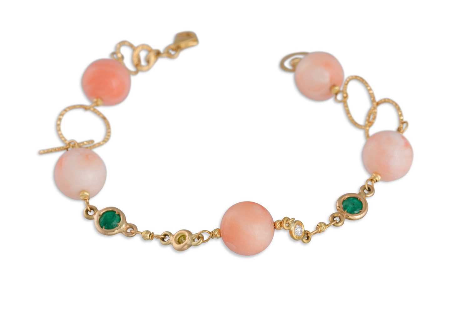 Lot 356 - A CORAL EMERALD AND DIAMOND BRACELET, mounted...