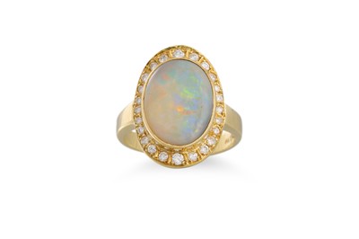 Lot 389 - AN OPAL AND DIAMOND RING, the oval opal to a...