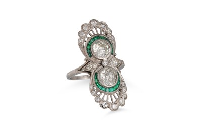 Lot 407 - A DIAMOND AND EMERALD RING, of up finger...