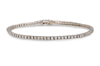 Lot 464 - A DIAMOND LINE BRACELET, mounted in 14ct white...