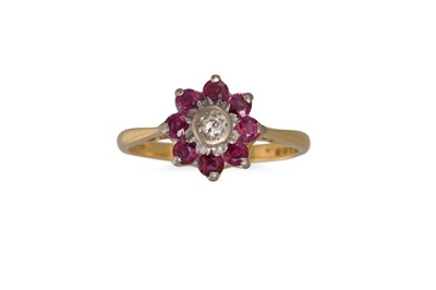 Lot 311 - A RUBY AND DIAMOND CLUSTER RING, in 18ct gold....