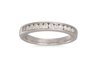 Lot 426 - A DIAMOND HALF ETERNITY RING, channel set...