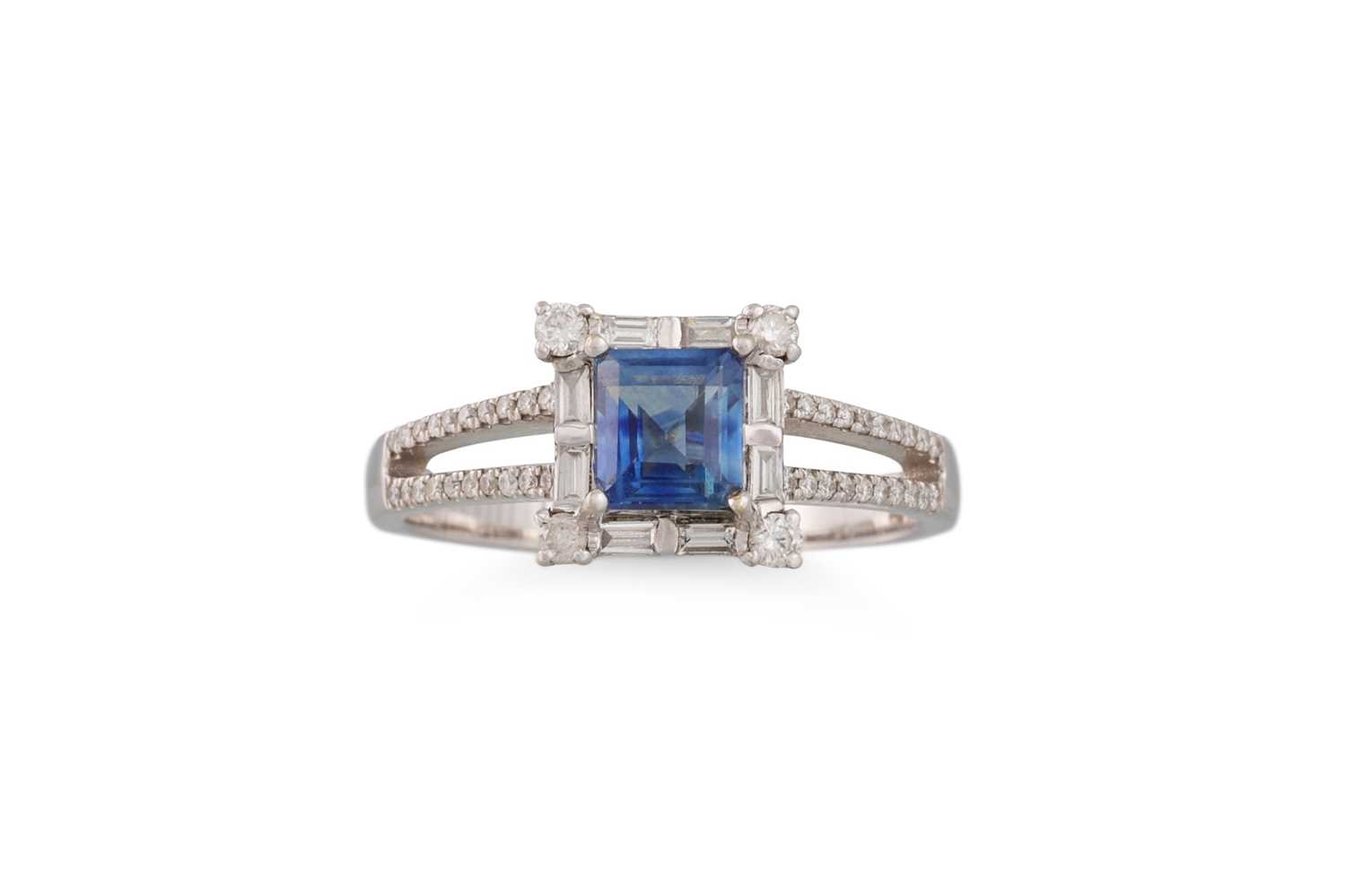Lot 394 - A SAPPHIRE AND DIAMOND CLUSTER RING, mounted...