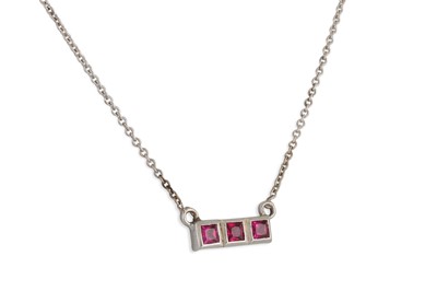 Lot 67 - A RUBY NECKLACE, set with three princess cut...