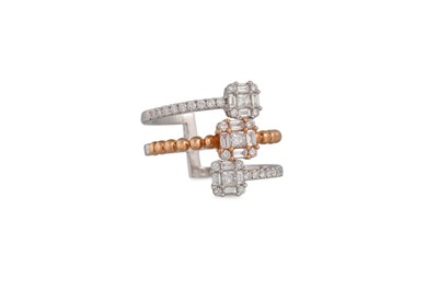 Lot 131 - A DIAMOND CLUSTER RING, of cross over form,...
