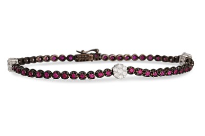 Lot 136 - A RUBY AND DIAMOND BRACELET, the line of rubes...